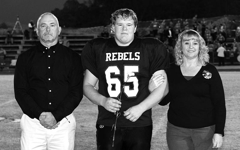 Standing on the field at Fannin High for senior night are, father, Jerry Daves, Geoffrey Daves and mother, Rhonda Daves.
