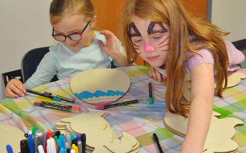 At Epworth First Baptist’s Easter Extravaganza, Sarah Burns Brown, left, and Ruby Dyer made beautiful works of art at the coloring station.