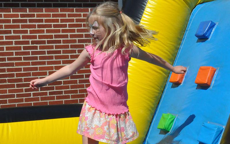 Lucy Grant loved the blow up obstacle course at the Easter Extravaganza and raced thorough several times.