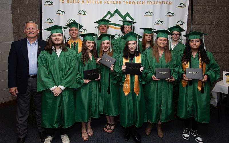 Mountain Education Students earned their high school diplomas and celebrated at graduation. Taking part in the event were, from left, front, Xander Parks, Kelsey Greene, Shayna Bolmon, Aislinn Peel, Alayha Spriggs, and Vanesa Medrano-Roman; and, back, State Representative Johnny Chastain, Tristin Pace, Cameron Goodwin, Darryl Carpenter, Kaitlyn Murray, and Hunter Mark.