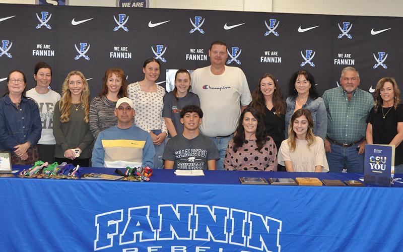 Zechariah “Zech” Prater (seated center) signed his Letter of Intent Friday to run track and field at Charleston Southern University. He was joined for his signing by, from left, seated, his father Shane Prater, his mother Ashley Prater, and his sister Rachel Prater. He was also joined by several members of his extended family.