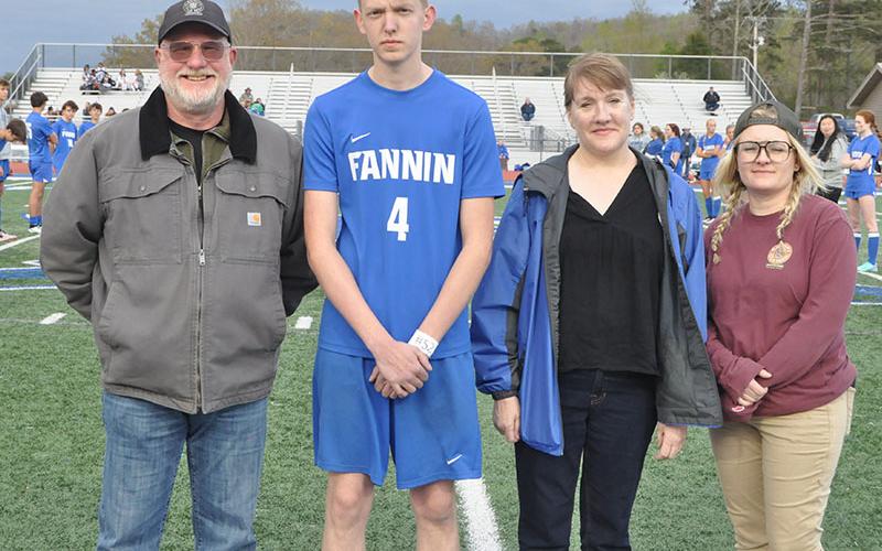 Soccer player Dane Robbins was among those honored at Senior Night. Shown with Robbins are, from left, father Forrest Head, mother Charlene Head, and sister Bethany Head.