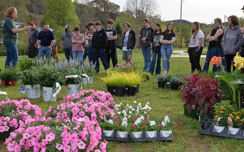 Ginger Montgomery, left, from Copper Basin High School helped lead Fannin and Basin students in designing flower beds at the Toccoa River Park in McCaysville.
