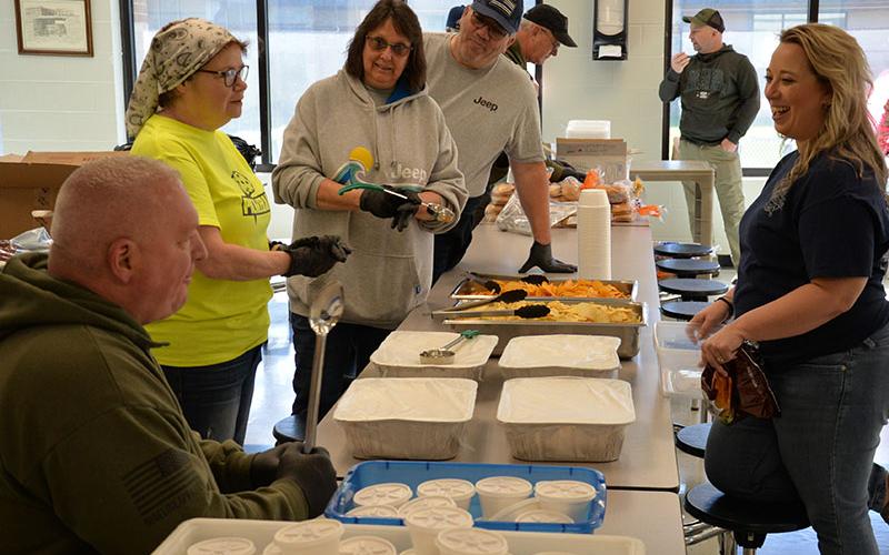 Members of American Legion Post 248 in Blue Ridge were on hand to help with the Ridge the Ridge fundraiser for Shop With a Cop. Charlie Yannis, from left, Liz Walters, Liz Copenhaver (non-member),  and Scott Copenhaver get ready to serve food.