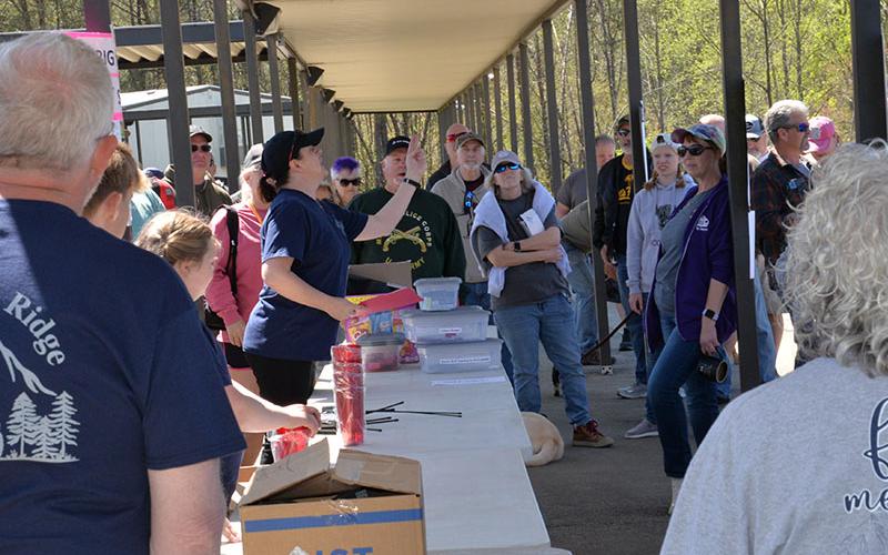 One of Ride the Ridge’s organizers, Dawn Cochran, center, drew door prize winners Saturday.