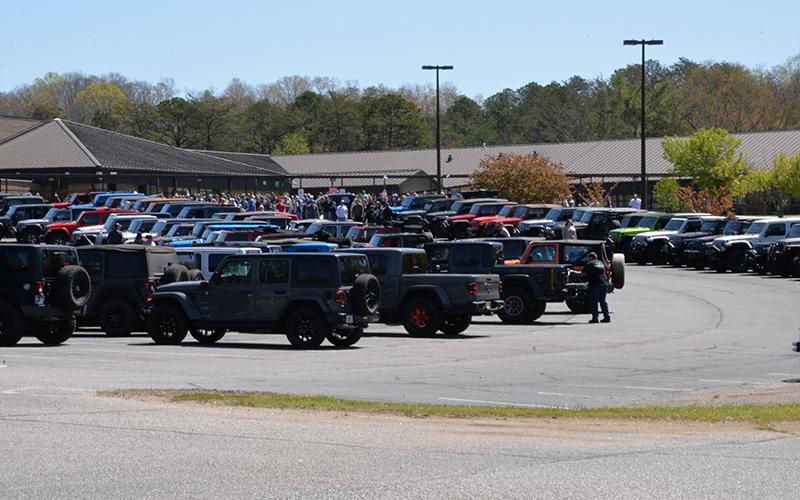 Jeeps and people filled the parking lot at Fannin County Middle School on a sunny morning Saturday for Ride the Ridge to benefit Shop With A Cop.