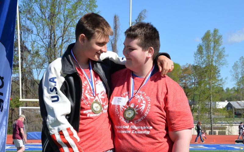 Maddix and Aiden from Fannin County Middle School congratulate each other on the winners podium.