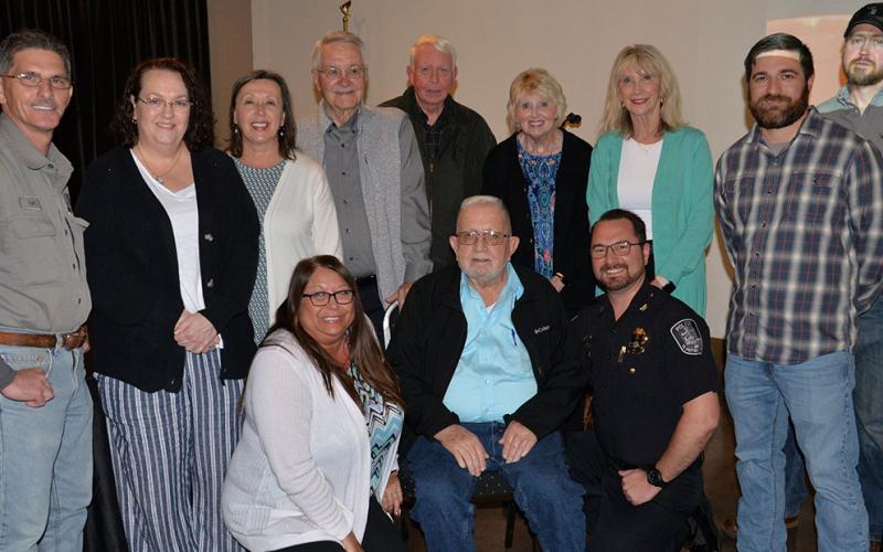 Thomas Seabolt is surrounded by city council members and city employees at Tooneys following his announcement he was resigning as mayor due to health reasons. Offering their thanks were, from left, front, Amanda Wood, Seabolt, Michael Earley; and, back, Earl Hughes, Tammy Henry, Nancy Godfrey, Billy Wayne Chastain, Gilita Carter, Susan Kiker, Jason Woody and Devy Ensley.