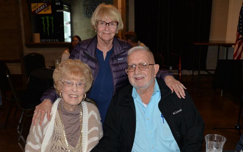 Ann Williams, standing, and Sue Beaver shared memories with Thomas Seabolt during a celebration of his years in office at Tooneys in McCaysville. Seabolt was first elected in 2011 and had just been re-elected to begin a fourth term in January 2024. Health reasons have forced his resignation.
