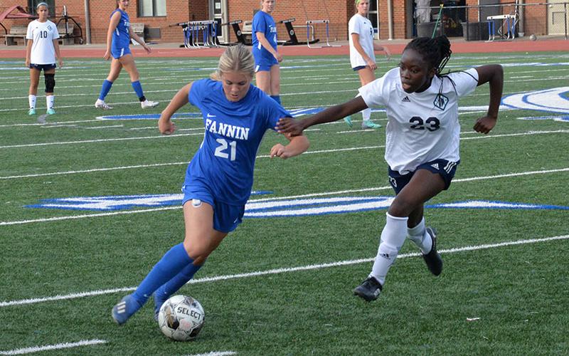 Shown following the 4-3 victory are, from left, front, Caroline Young, Emma Richardson, Bridgett Allen, Stephanie Kirk, and Shaylee Jones; second row, GiGi Torres, Natalie Middleton, Eleanor Hodgson, Carmen Alvarez Perguero,  Reese Lewis, Avi Ethington, Jayda Foster, Nadia Rosas-Leal, and Jordan Golden; and back row, Coach Jessen, Grace Fay, Harper Foster, Lacole Moler, Kinsley Pickelsimer, Olivia  Phillips, Annaleigh Cheatham, Delmy Saqui-Sacul, Karmah Eaton, and Coach Deal.