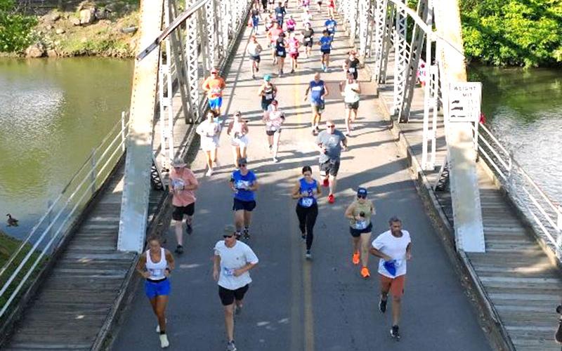 All three races in the Riverwalk Run Series take participants across the iconic steel bridge in McCaysville, which now features a new surface. The Trout Trot is the next race, scheduled for April 27.