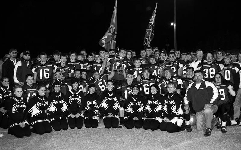 The team and cheerleaders celebrate their Region Championship win.