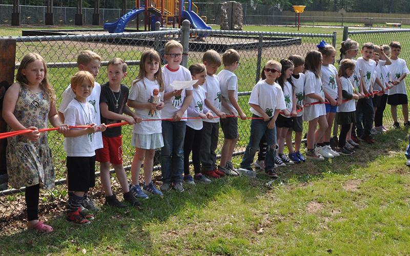 The first and second graders of West Fannin elementary were so excited for the Frog Bog to officially open. Shown, from left,  Lena Thomas, Titus Stanley, Joel Curtis, Kason Rogers, Autumn Blomeley, Ryles Thomas, Avery Anderson, Ronin Burke, Asher Stanton, Hayden Jones, Kaylin Postell, Ezra Loudermilk, Callie Mayfield, Bella Holloway, Ashlyn Jessen, Baker Born, and Oliver Herndon.