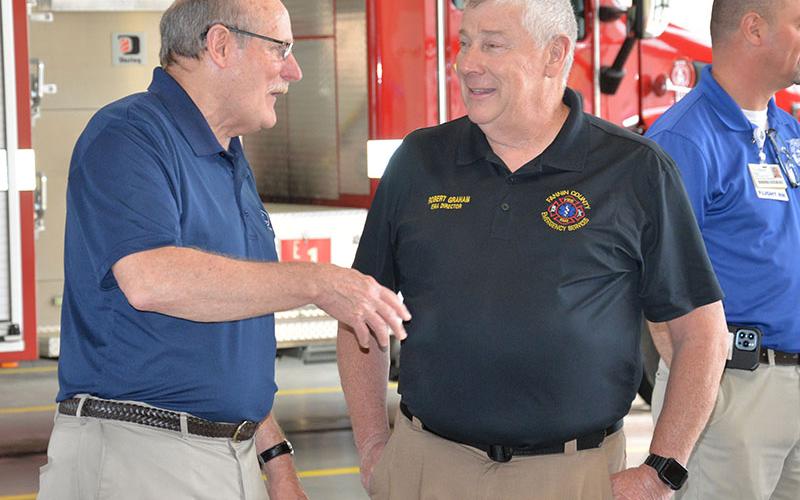 Fannin County Post 2 Commissioner Glenn Patterson gives Robert Graham some retirement advice during the reception to honor Graham May 16.