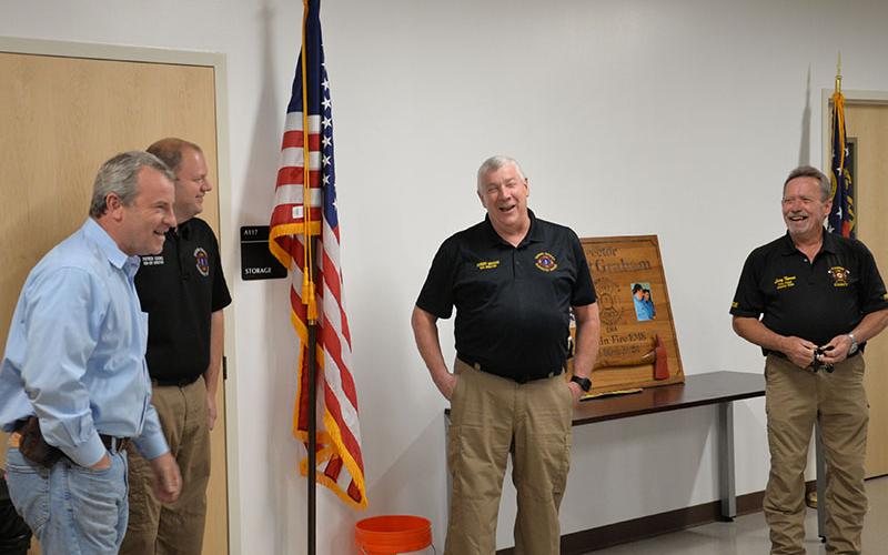 Fannin County Sheriff Dane Kirby, left, shared a story about Robert Graham’s early days that got a laugh from new Emergency Management Agency Director Patrick Cooke and Graham. Not surprisingly, Graham later denied the story was true.