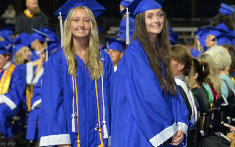 All smiles as these graduates collect their diplomas in front of fellow students, family and friends.