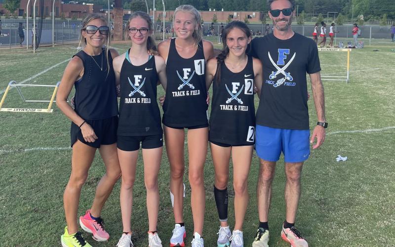 Fannin County High School’s Sydney Ford, Lindsey Holloway, and Karil Sams all earned spots in the 3200 meter Track &amp; Field State Championship run. Shown following their performances at the Sectional Meet are, from left, Head Coach Miranda Roof, Ford, Holloway, Sams, and Coach Dr. Lucas Roof.