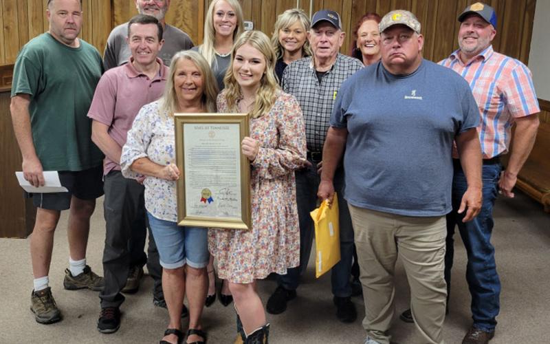 The Polk County commission honored Zoie Hatcher for her state championship in agribusiness. Shown with her are commissioners John Pippenger, Keith Barker, Danny Carver, Debbie Davis, Samantha Trantham, Hatcher, Kelley Morgan, Mush Davis, Christy Hardin, Greg Brooks and County Executive Robby Hatcher.