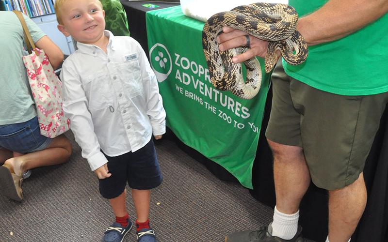 Striker McHan wasn’t sure how to feel when he saw a snake at the Live Animal event at the Fannin County Public Library.