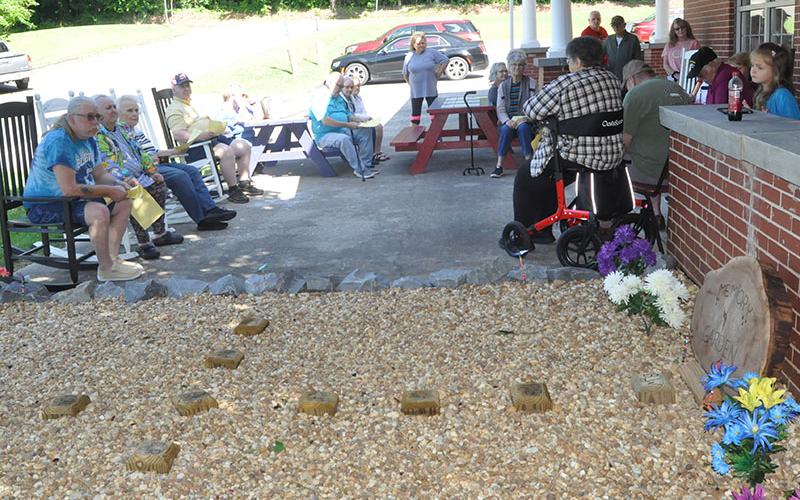 Several members of the Senior Center gathered on the patio area to honor those who have passed.