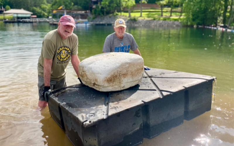 Former LBRCA President Dale Greene and current LBRCA President Dan Myers pose with an abandoned dock float which could pose a hazard to boaters.