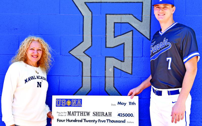 Matthew Shirah is shown accepting the check that represents his scholarship to the United States Naval Academy during a ceremony on the baseball field at Fannin County High School. Shirah was a baseball standout for FCHS as well as valedictorian of the Class of 2020.