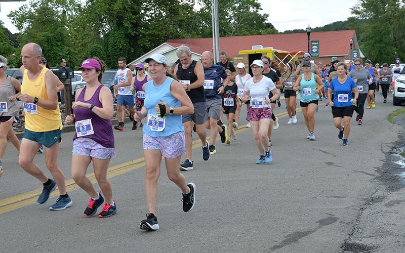 Competitors begin the Walk the Line 5K through McCaysville and Copperhill Saturday evening. Race sponsors said 200 runners signed up for the event, the second in the annual Riverwalk Run Series. A total of 164 participants finished the course that crosses the Toccoa River twice.