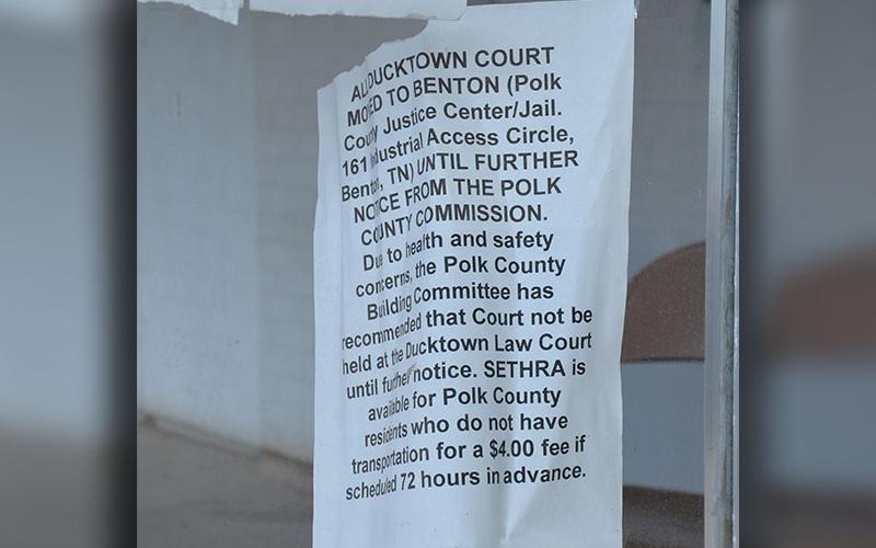 This announcement from November 2022 continues to barely hang on the front door of the Polk County courthouse in Ducktown. Commissioners will meet there this week as they work to build a new building.