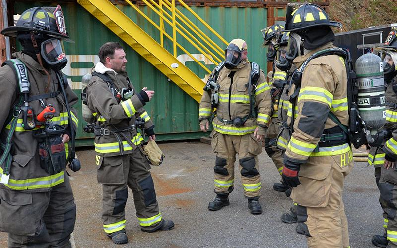 Fannin County Fire Department Training Chief Michael Cornelius, second from left, briefs a group of firefighters as they prepare for training in the department’s burn building, which is located behind Station #1 in Blue Ridge. Shown with Cornelius are, from left, Jim Edelstein, Brett Craine, Mike Miller, Hunter Patterson and Courtney Craine. The training took place last Saturday evening, July 27.