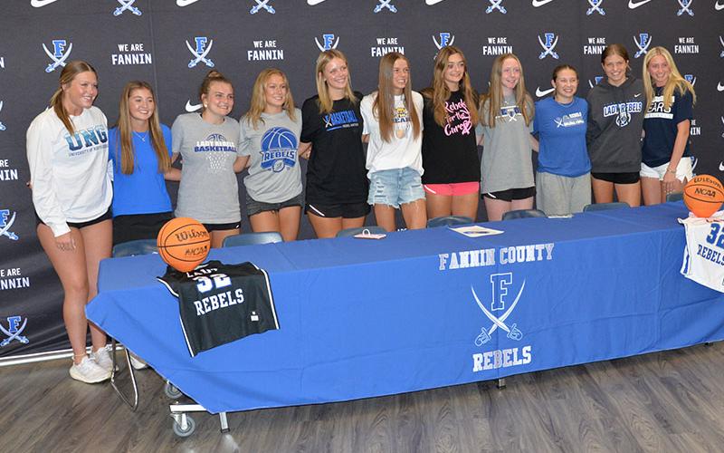 A crowd of some 80 people showed up to celebrate Macy Hawkins’ Letter of Intent signing to play basketball for the Truett McConnell University Bears. Among them were Lady Rebel teammates, from left, Addison Smith, Courtney Davis, Maggie Ledford, Callie Ensley, Emma Holloway, Hawkins, Reece Lewis, Emma Buchanan, Izzy Jabaley, Annabelle Anderson and Ava Lackey.