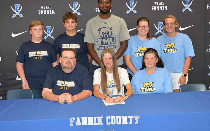 Macy Hawkins was surrounded by her family as signed her Letter of Intent to play basketball for the Truett McConnell University Bears. Witnessing the event were, from left, front, Michael Davis, Hawkins,  and Vera Davis; and, back, Cooper Davis, Levi Davis, Bears Coach Tiek Fields Kayla Shields and Holly King.