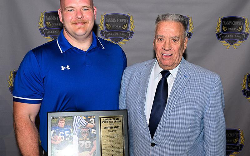 Inductee Geoffrey Daves accepted his Fannin County Sports Hall of Fame plaque from board member Windell Davis.