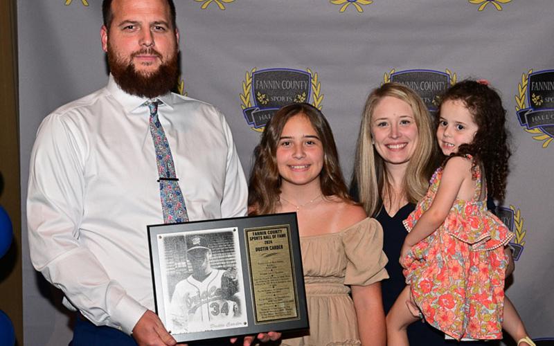 Fannin County Sports Hall of Fame inductee Dustin Carder accepted his plaque and is shown with his wife Sara and children Adelay and Brintlie.