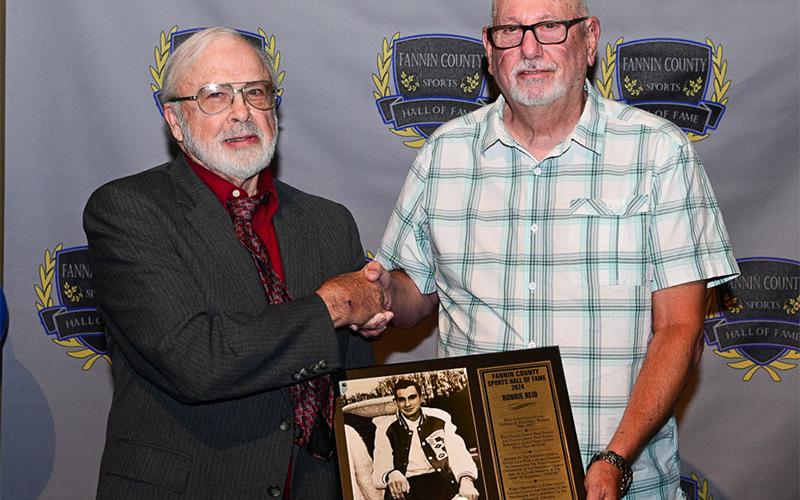 The late Ronnie Reid was inducted, and his plaque was presented by FCSHOF board member Tom Hamby to Ronnie’s cousin Larry Sparks,