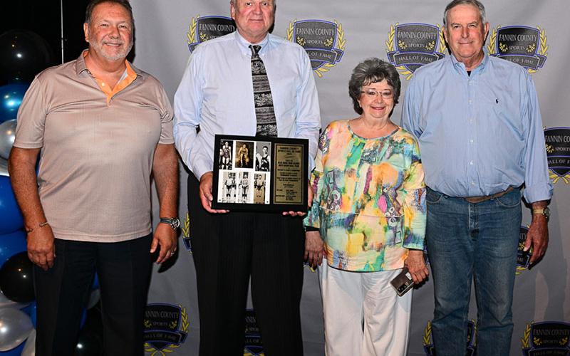 The 1942-43 Blue Ridge boys basketball team was inducted into the Fannin County Sports Hall of Fame this year. Children and relatives of team members, from left, John Querry, representing his father Ed Querry; Johnny Farmer, for his father Junior Farmer; Marie McGill Herndon, for her uncle Bill McGill; and Fred Jones Jr., for his father, attended the induction ceremony and accepted the plaque. Other team members were Jack Miller and Oliver LeMaster.