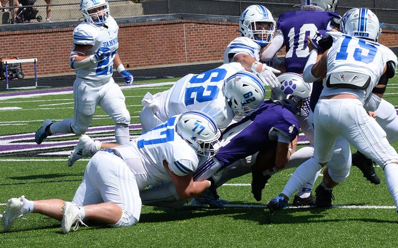 Fannin County’s defense held Rabun County to only 55 total yards Friday. Among those who regularly make an impact are shown here the in the previous week’s action against Gilmer County. From left are CJ Reece (23), Jacob Green (77), Case Holloway (62), Cooper Born and Scotty Waldrep (15).