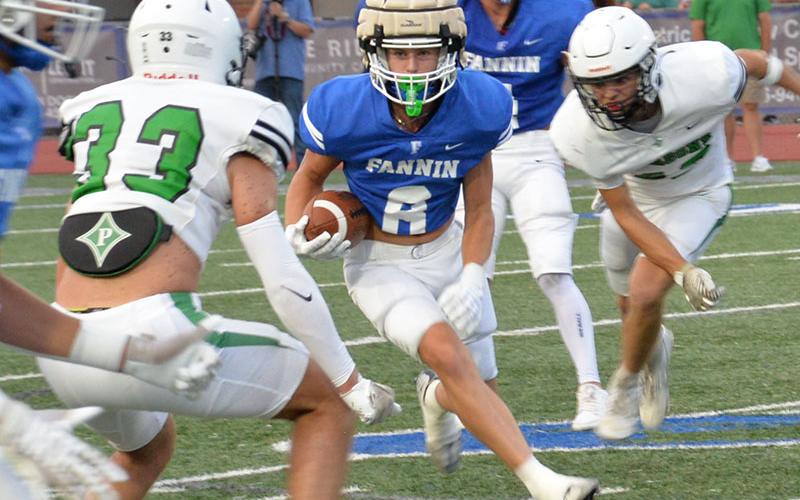Judah Wood (8) looks for running room against the Pickens County Dragons in Fannin’s scrimmage action Friday night.