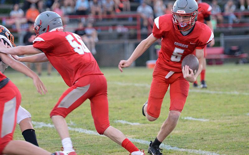 Talon Smith looks for running room behind a block by Mason Anderson in Copper Basin’s scrimmage last Friday night.