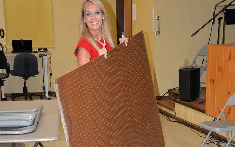 Polk County District 3 Commissioner Samantha Trantham helped clean out a cluttered office to provide more space for senior citizen activities at the Copper Basin Community Center.