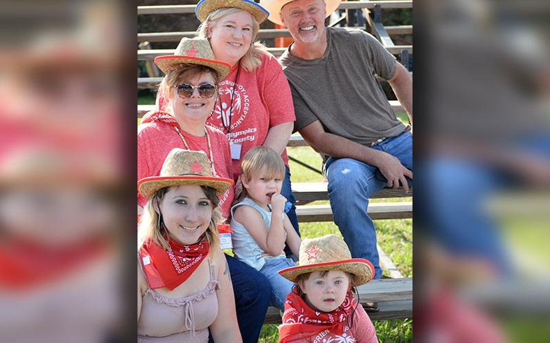All set to enjoy a rodeo preview are Special Education preschool teacher Scott Bryan, paraprofessionals Dorie Jones and Patsy Wood with Gabe, and Teagan in front with her mom Hannah.