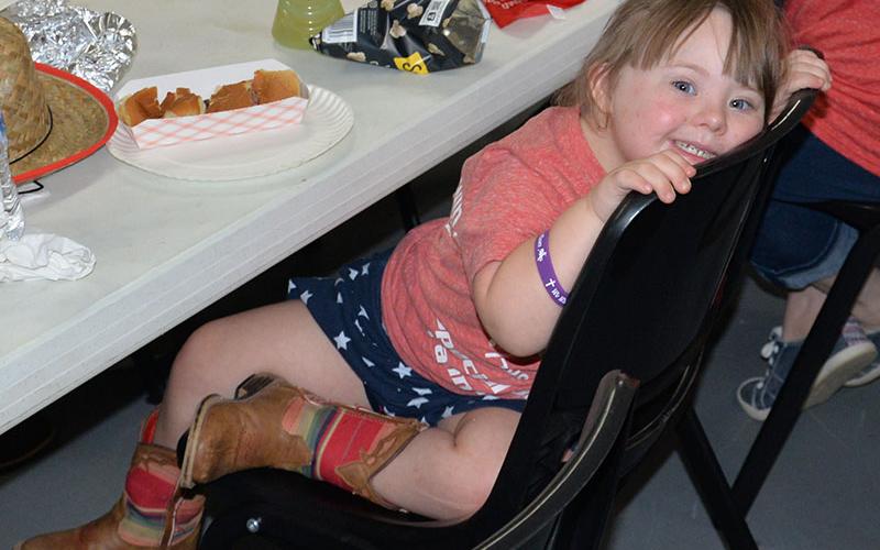 Preschooler Teagan took a break from eating lunch to show off for the camera Friday morning. Kiwanis Rodeo Chairman Kevin Panter thanked the sponsors who made the lunch possible.