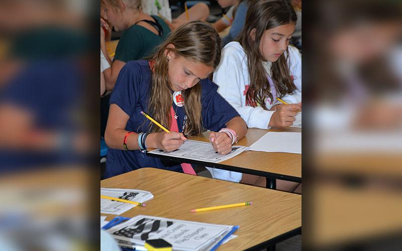 Oakley Baker, left, and Louann Brown breezed through their flag etiquette tests at Blue Ridge Elementary School.