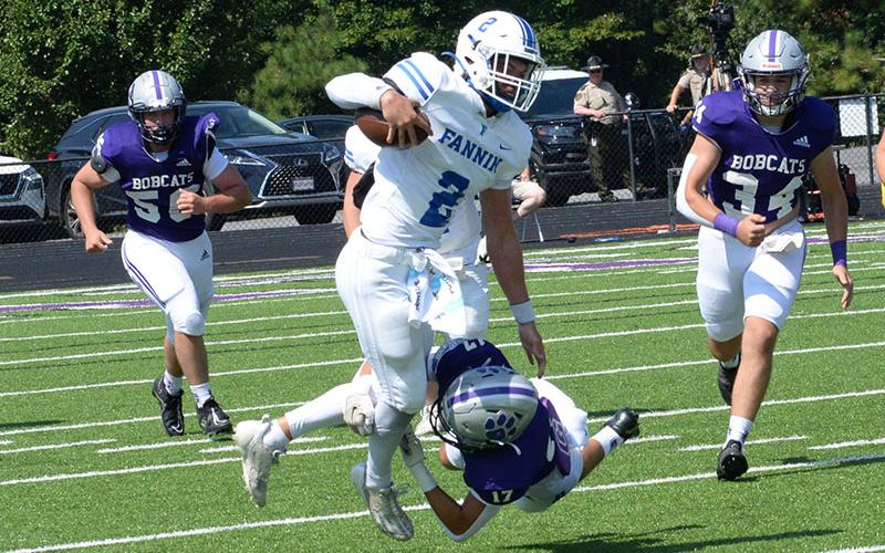 Lawson Sullivan (#2) works to get away from a Gilmer defender in action Saturday morning in Ellijay. Sullivan gained 164 yards on six carries during the game.