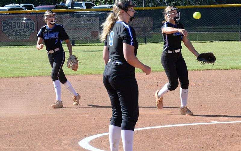 Myla Rogers throws a runner out for the Lady Rebels from her shortstop position.