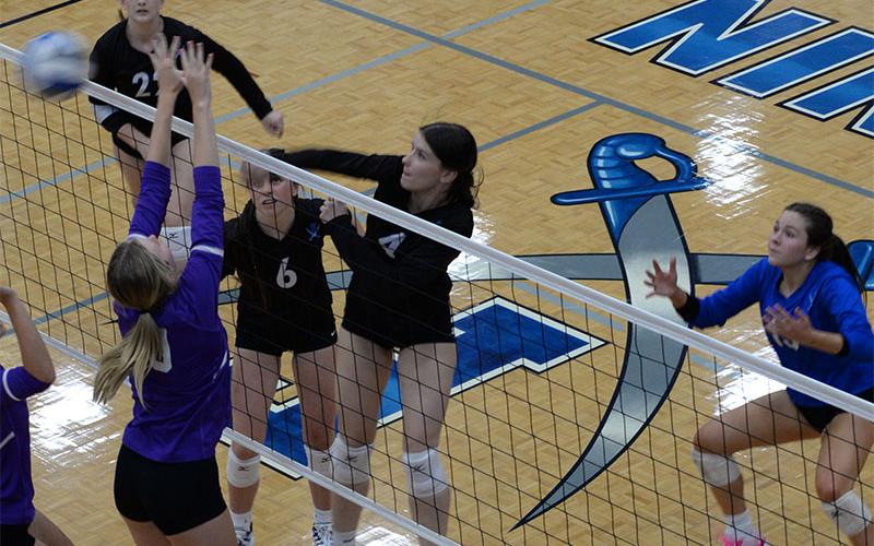 Fannin County’s Bailee Stiles (#4)  fires the ball back over the net in the Lady Rebels match against the Darlington School Tuesday, September 3. Fannin’s Ashlyn Jones (#6) and Karis Hurd (#22) assist in the action.