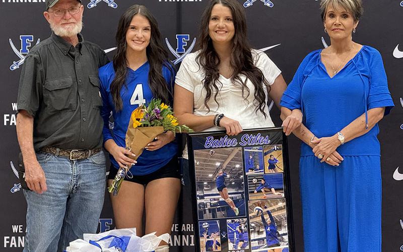 Bailee Stiles was escorted by Megan Stiles, Edward Stiles and Becky Harbin during Volleyball Senior Night ceremonies.