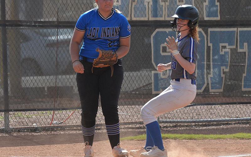 Makayla Stiles reaches third base safely for the Lady Rebels in action earlier this season.