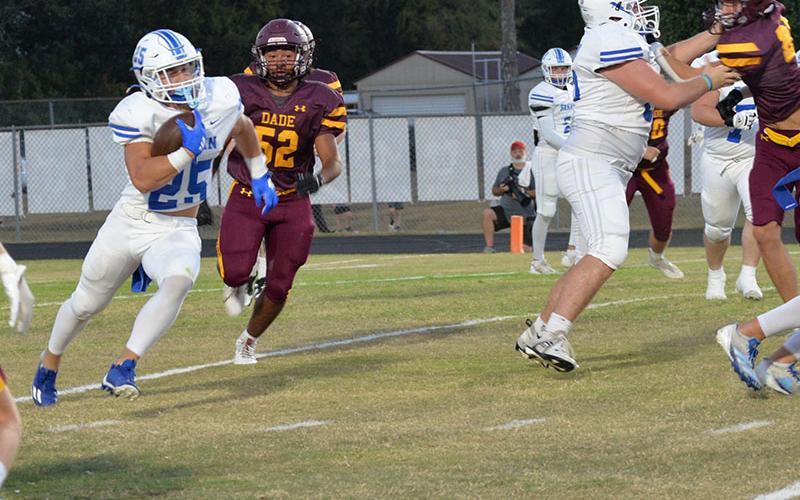 Baylor Twiggs (#55) helps open a hole for Carson Callihan against the Dade County Wolverines in Trenton, Georgia, Friday night. The Rebels won the game 44-0 behind a strong combination of offensive and defensive efforts.