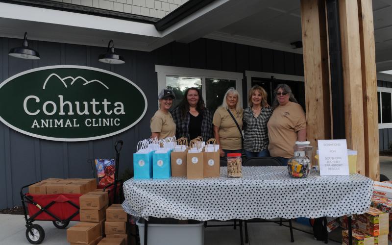 Barking Buddies (BB) is a group of volunteers who promote shelter animals in Fannin County for rescue or adoption. They attended the vaccine event at Cohutta Animal Clinic to distribute pet gift bags. Shown at the clinic, from left, are BB volunteer Donna Turek, animal control employee Brandy Padgett, BB volunteers Marge Agald, Sandy Taylor and Tina Lacombe.