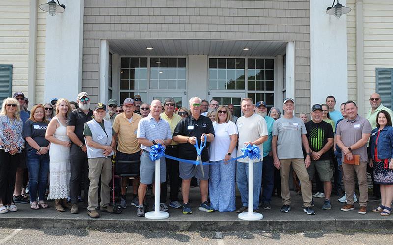 The North Georgia Veterans Assistance Foundation was honored with a ribbon cutting for joining the Fannin County Chamber of Commerce Wednesday, September 11. In the front row are, from left, Cindy Querry, Susan Ross, Lisa Doherty, Tim Doherty, Walt Polk, Robert Foster, Jeff Lake, Ken Brenneman, Amy Bevan, Mike Panter, Jimmy Jones, Paul Toy, Chan Mitchell and Glenda Reilly.
